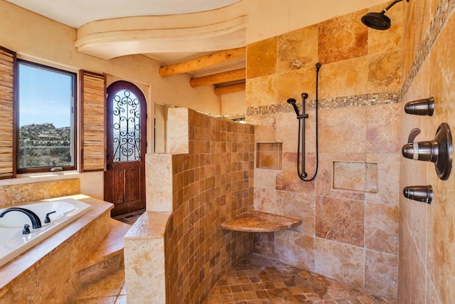 bathroom featuring shower with separate bathtub