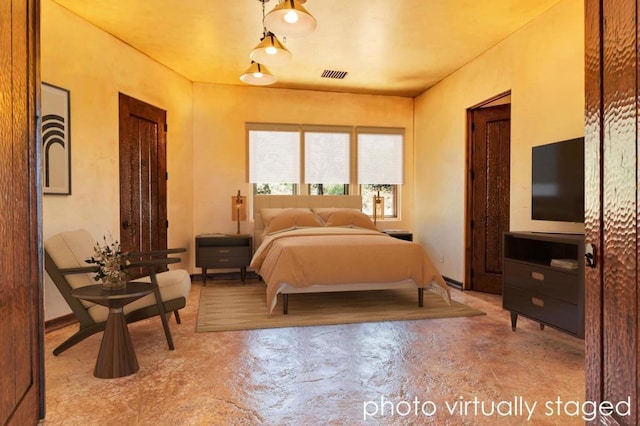 bedroom featuring concrete floors