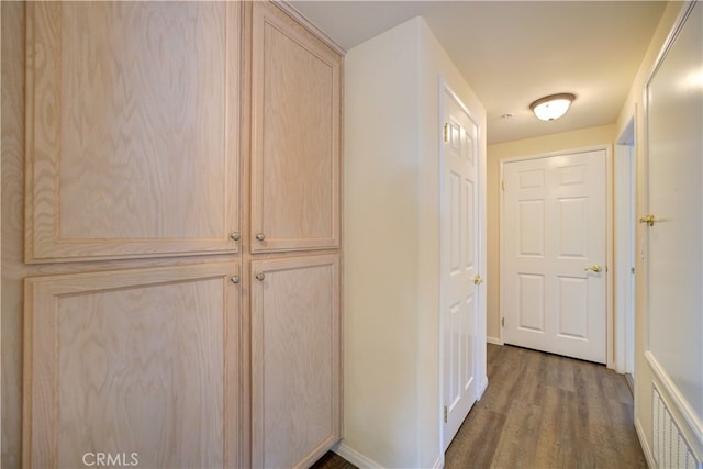 corridor featuring dark hardwood / wood-style flooring