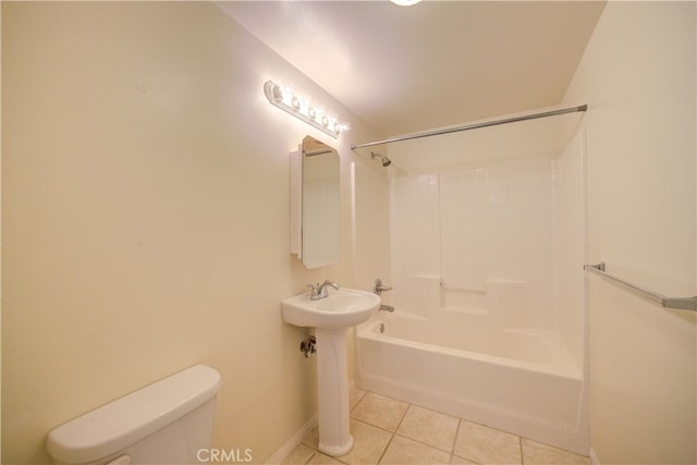 bathroom featuring  shower combination, tile patterned floors, and toilet