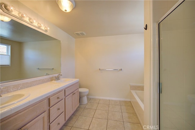 full bathroom featuring shower with separate bathtub, vanity, tile patterned floors, and toilet