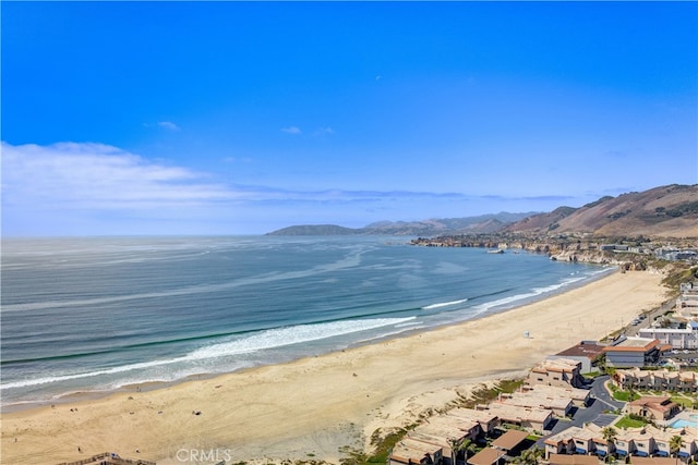 property view of water featuring a view of the beach and a mountain view