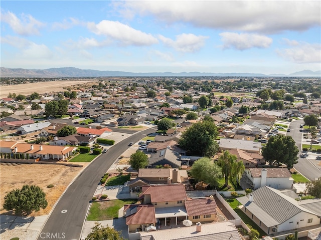 drone / aerial view featuring a mountain view