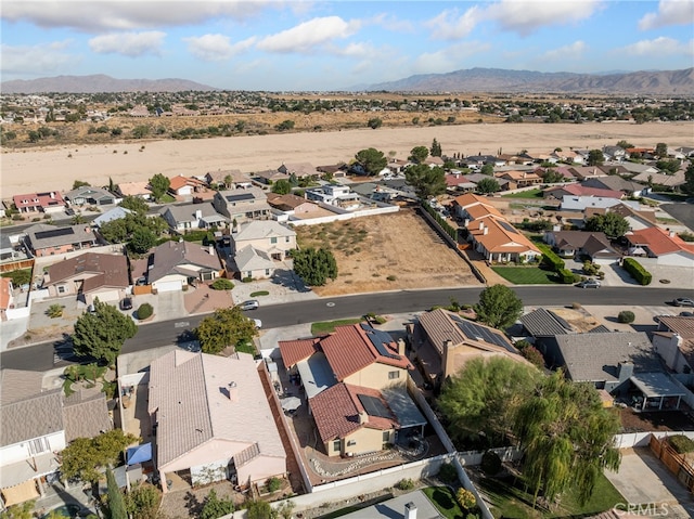 birds eye view of property featuring a mountain view