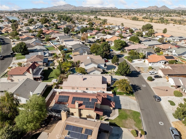 birds eye view of property with a mountain view