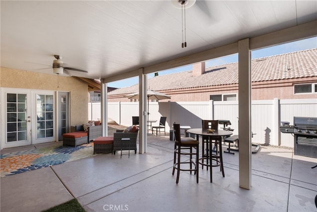 view of patio / terrace with an outdoor living space and ceiling fan