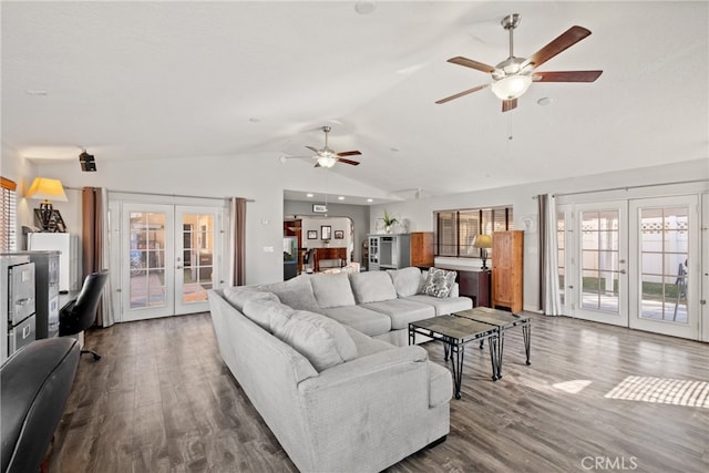 living room with french doors, vaulted ceiling, and ceiling fan