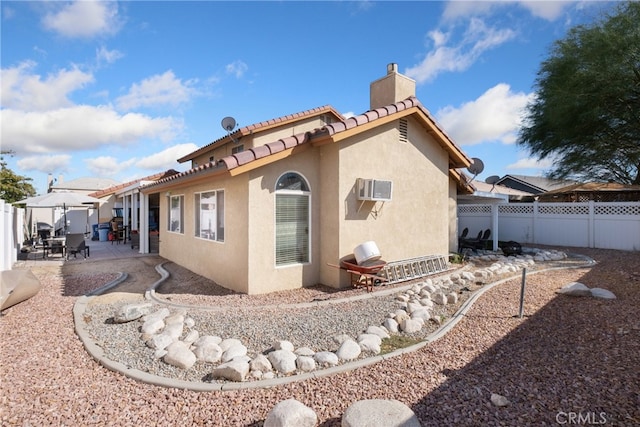 back of property featuring a patio area