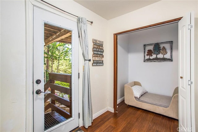 30421 Live Oak Dr, Running Springs, CA 92382 - doorway to outside with dark wood-type flooring and baseboards