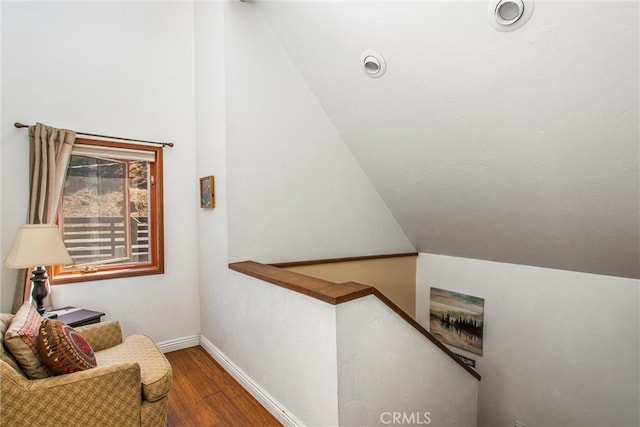 30421 Live Oak Dr, Running Springs, CA 92382 - interior space featuring an upstairs landing, vaulted ceiling, wood finished floors, and baseboards