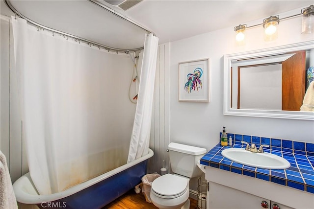 30421 Live Oak Dr, Running Springs, CA 92382 - bathroom with toilet, vanity, visible vents, and shower / bathtub combination with curtain