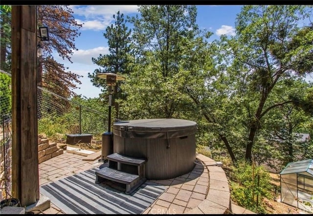 30421 Live Oak Dr, Running Springs, CA 92382 - view of patio featuring a hot tub and fence
