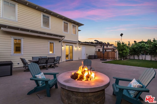 patio terrace at dusk with an outdoor fire pit