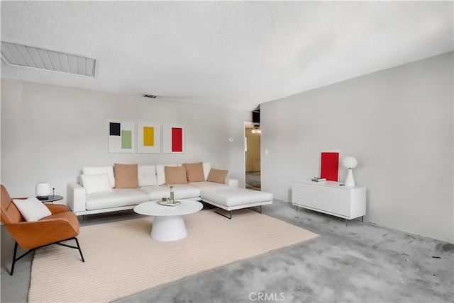 living room featuring a textured ceiling and carpet floors