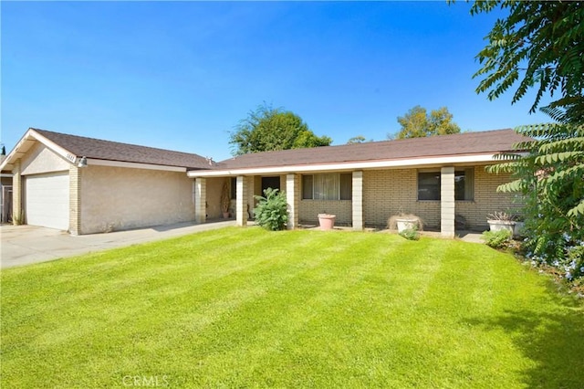 ranch-style house featuring a front yard and a garage