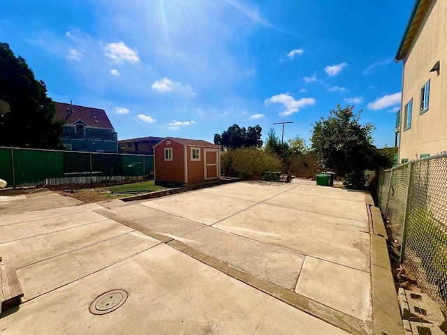 view of patio / terrace with a storage shed