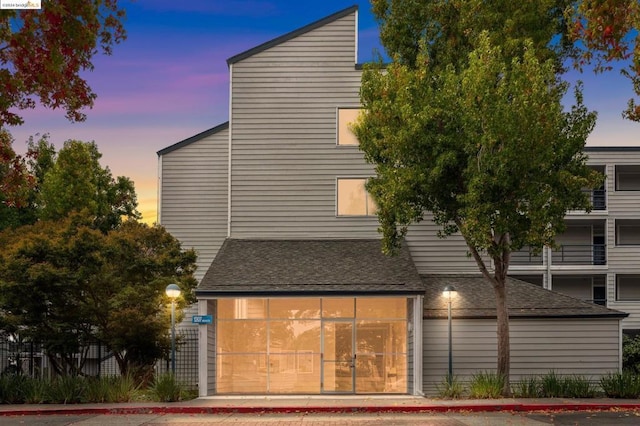 view of property exterior at dusk