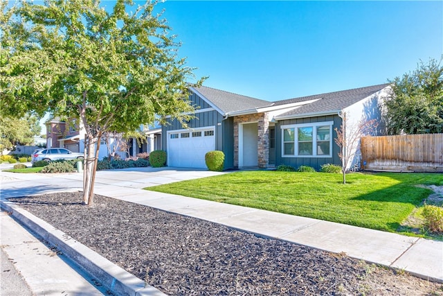 single story home featuring a garage and a front yard