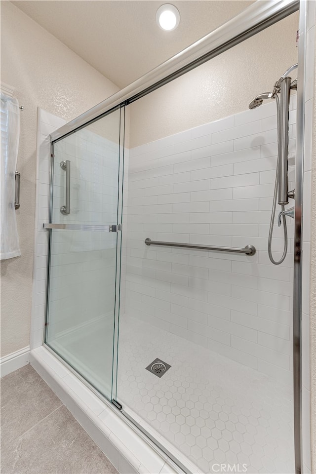 bathroom featuring an enclosed shower