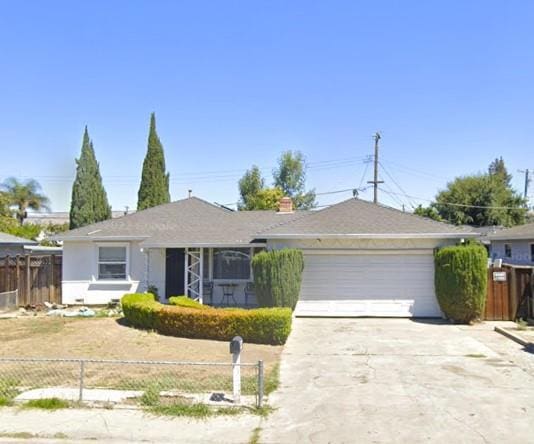 ranch-style home with a garage