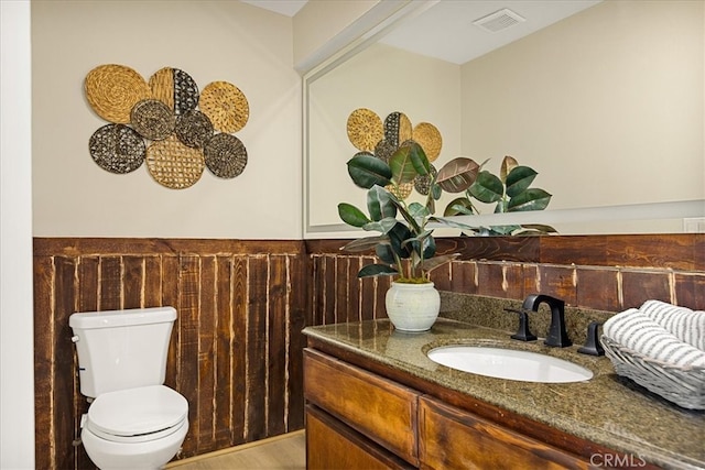 bathroom with vanity and toilet