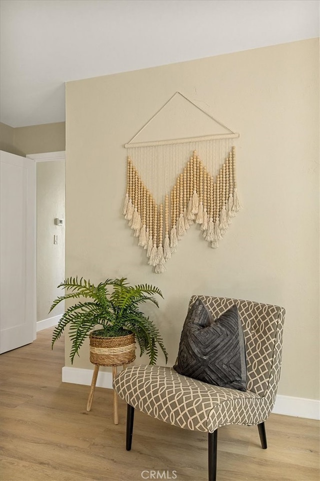 living area with light hardwood / wood-style flooring