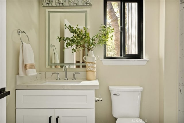 bathroom with vanity and toilet