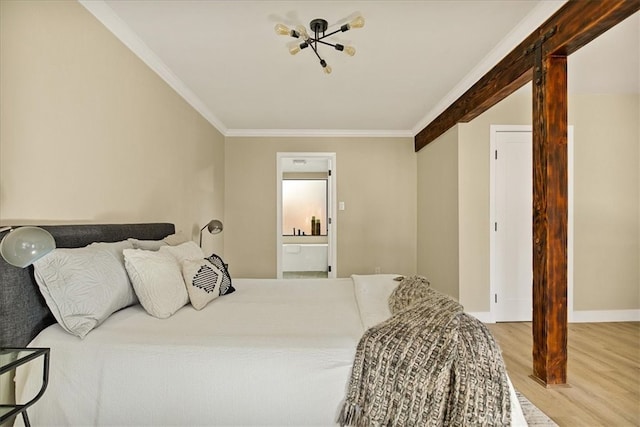 bedroom featuring connected bathroom, hardwood / wood-style floors, and crown molding