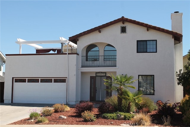 view of front of house with a balcony and a garage