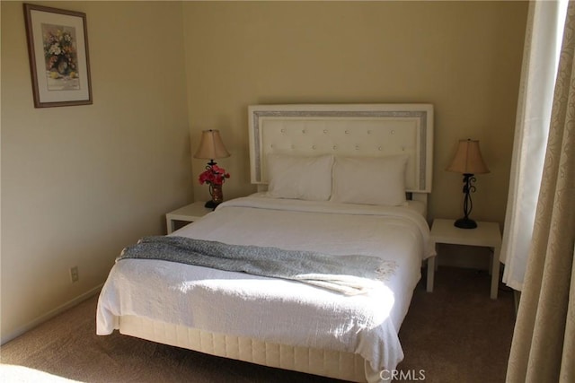 carpeted bedroom with baseboards
