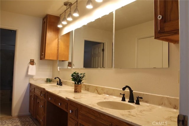 bathroom with double vanity and a sink