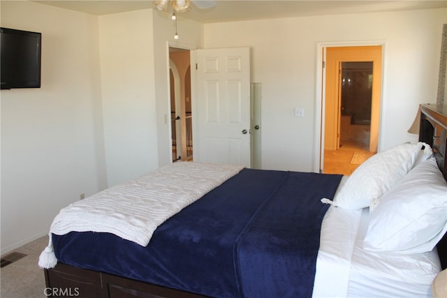 carpeted bedroom with ceiling fan