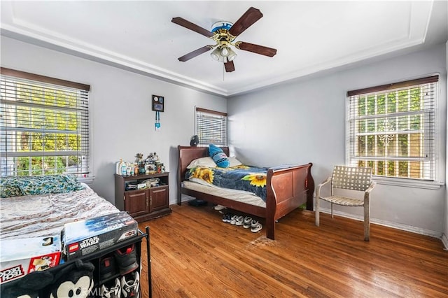 bedroom with hardwood / wood-style floors and ceiling fan