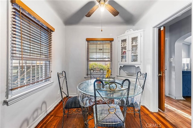 dining area with ceiling fan and hardwood / wood-style flooring