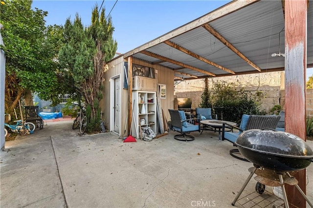 view of patio featuring a fire pit and grilling area