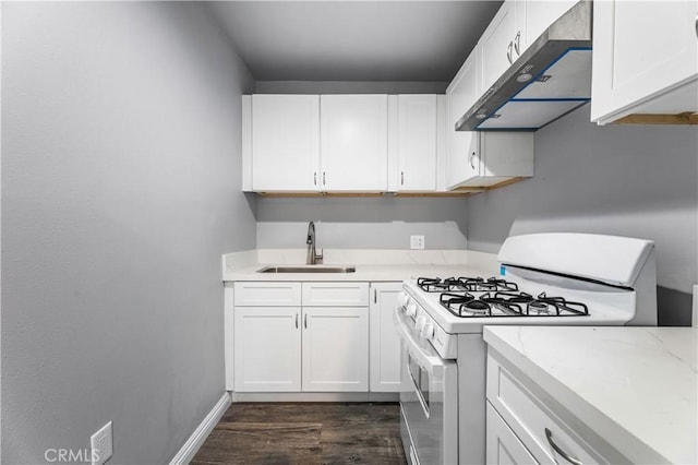 kitchen featuring white range with gas stovetop, ventilation hood, sink, dark hardwood / wood-style flooring, and white cabinetry