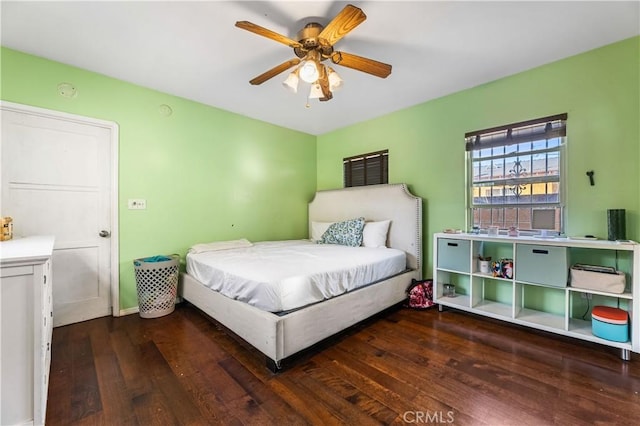 bedroom featuring ceiling fan and dark hardwood / wood-style floors