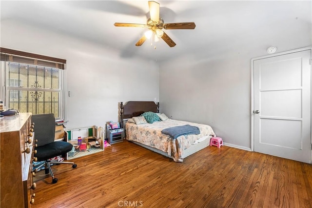 bedroom featuring ceiling fan and hardwood / wood-style flooring