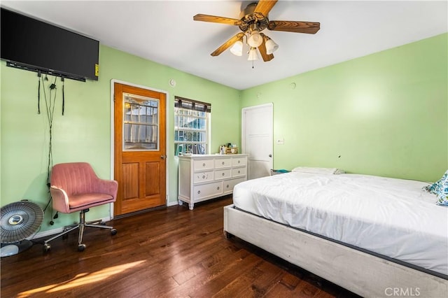 bedroom featuring ceiling fan and dark hardwood / wood-style flooring