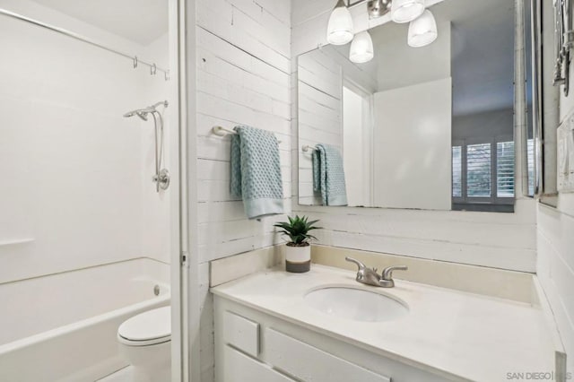 full bathroom with bathing tub / shower combination, vanity, and toilet