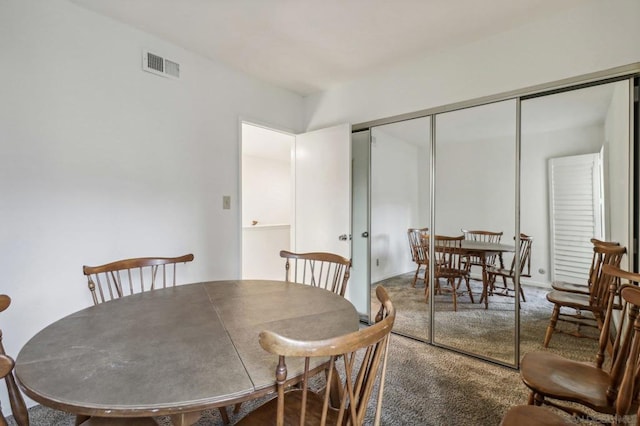 view of carpeted dining space