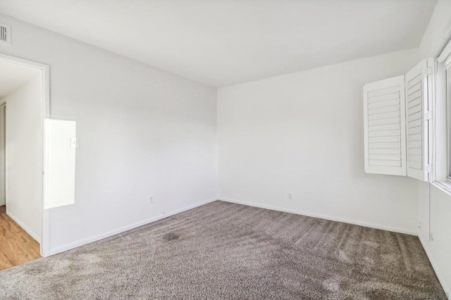 empty room featuring carpet flooring