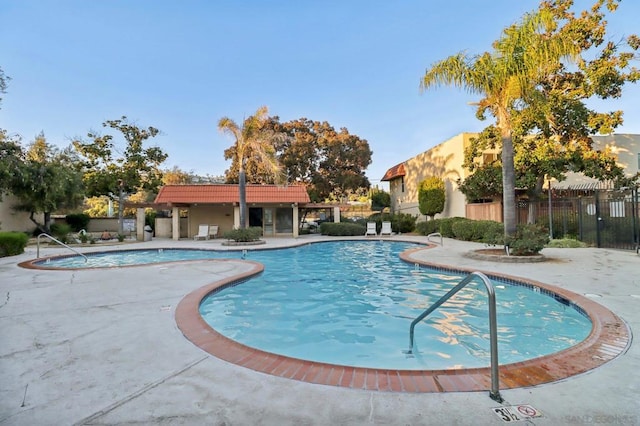 view of swimming pool featuring a patio