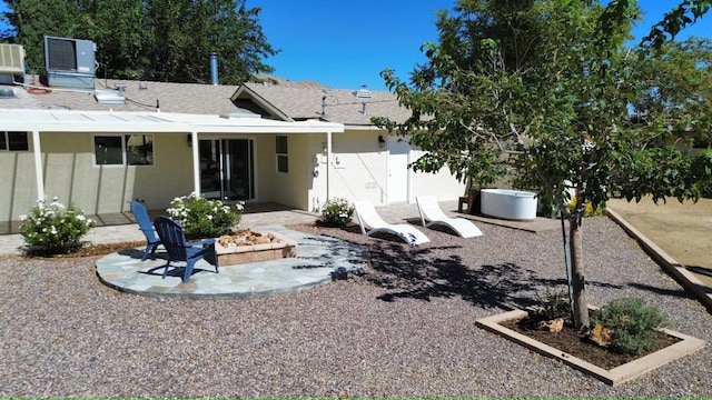 back of property featuring a patio