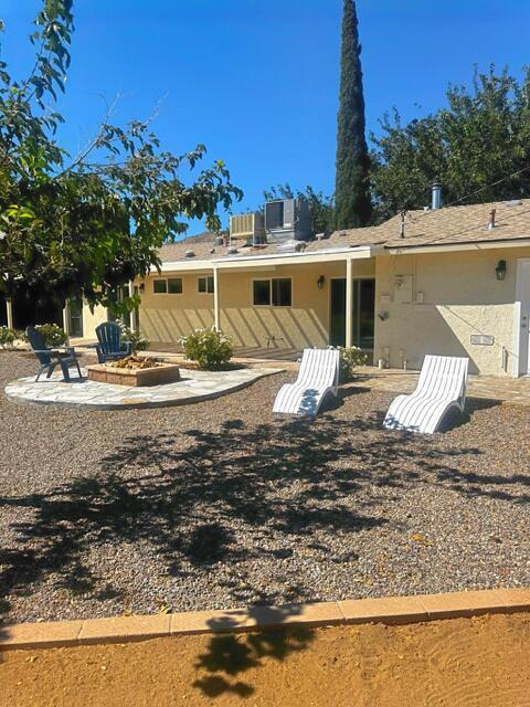 back of property with a patio