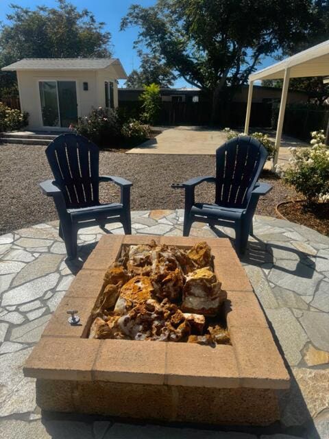 view of patio / terrace featuring a fire pit