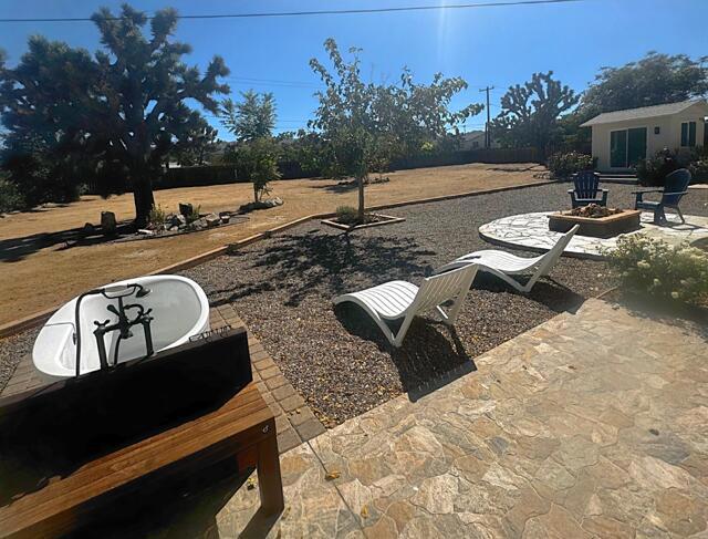 view of patio / terrace with a fire pit