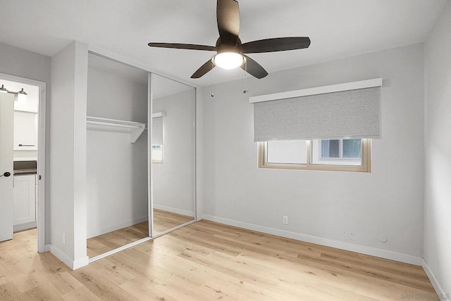 unfurnished bedroom with a closet, ceiling fan, and light hardwood / wood-style flooring