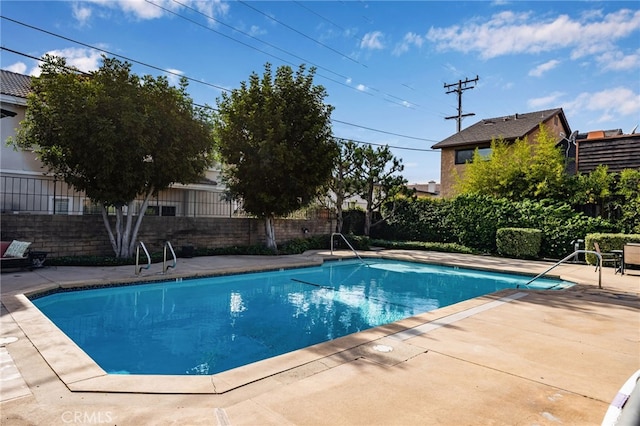 view of swimming pool featuring a patio