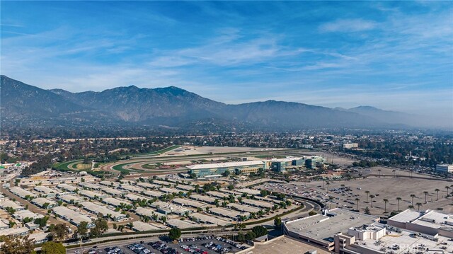 birds eye view of property featuring a mountain view